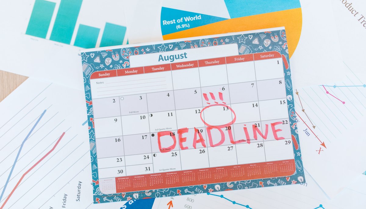 Desk calendar with DEADLINE written across it in red marker